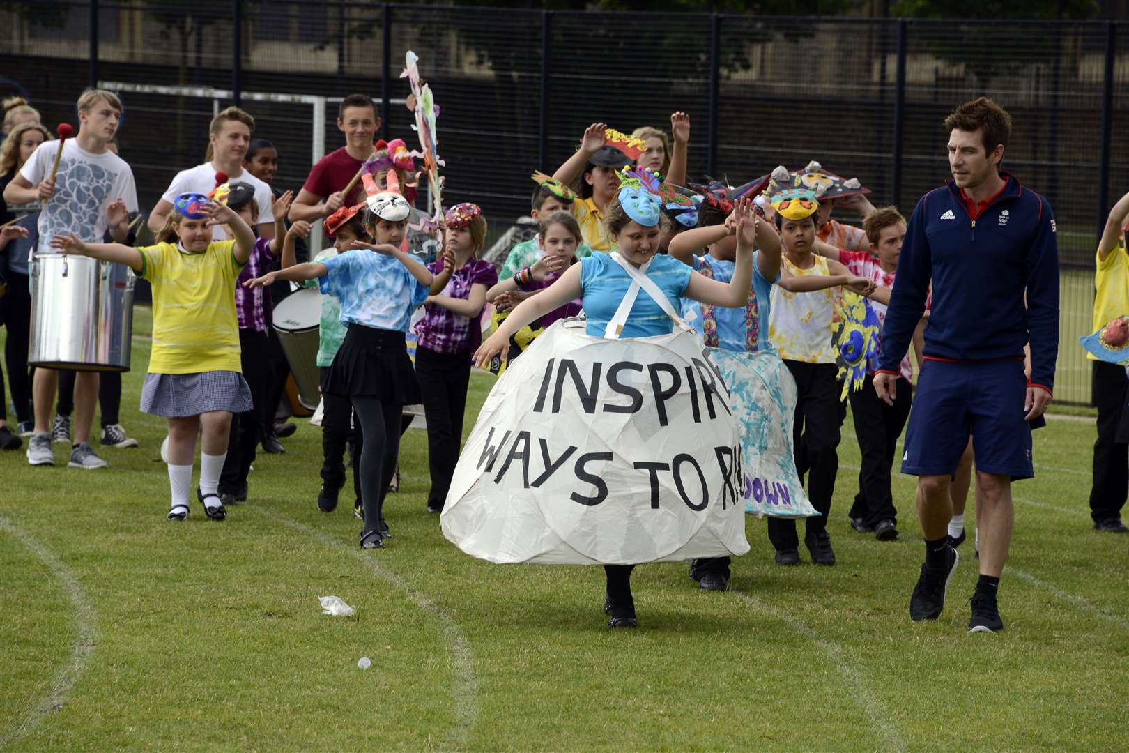 Olympian Chris Cook lead the parade around the school field