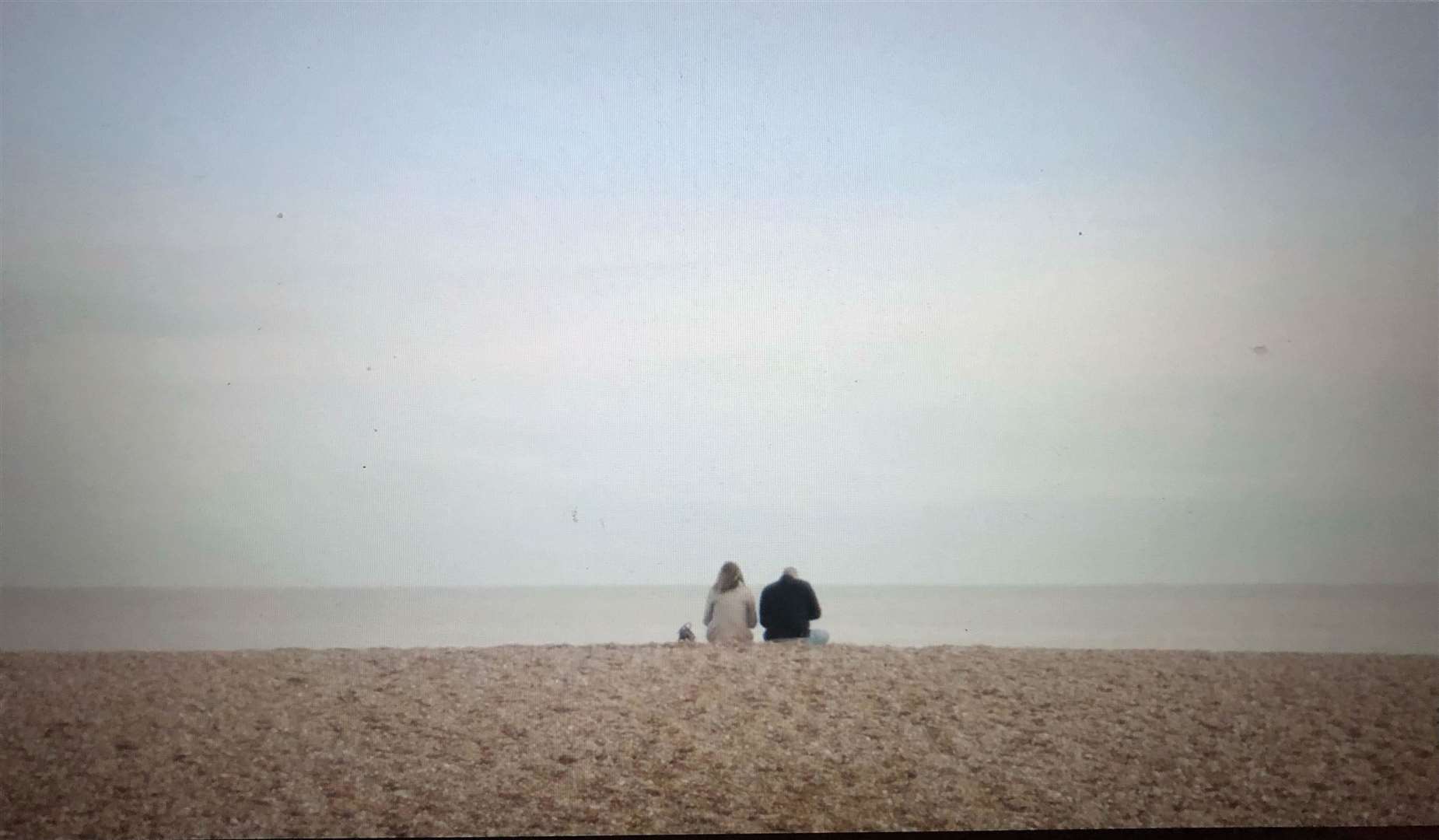 Characters sitting at Deal beach