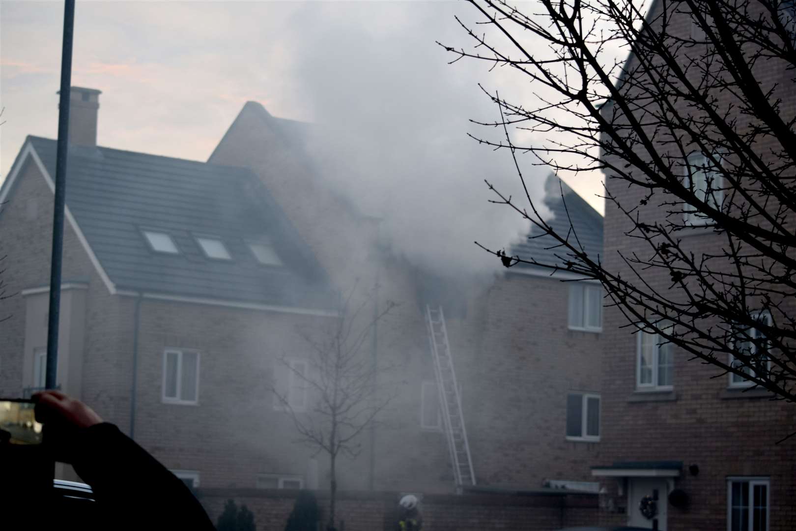 Smoke pours from the house fire on Buttercup Avenue (Peter Kellythorn)