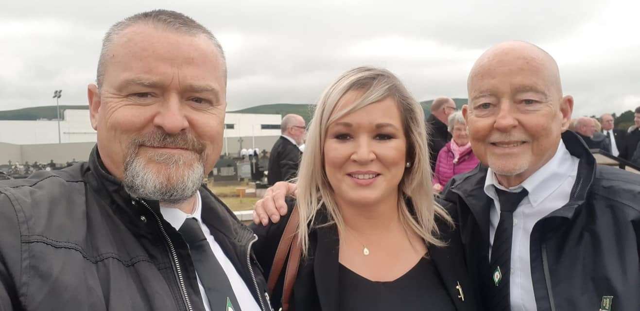 A photo posted on Lucan Sinn Fein Facebook page of Michelle O’Neill posing for a selfie with two attendees at Bobby Storey’s funeral