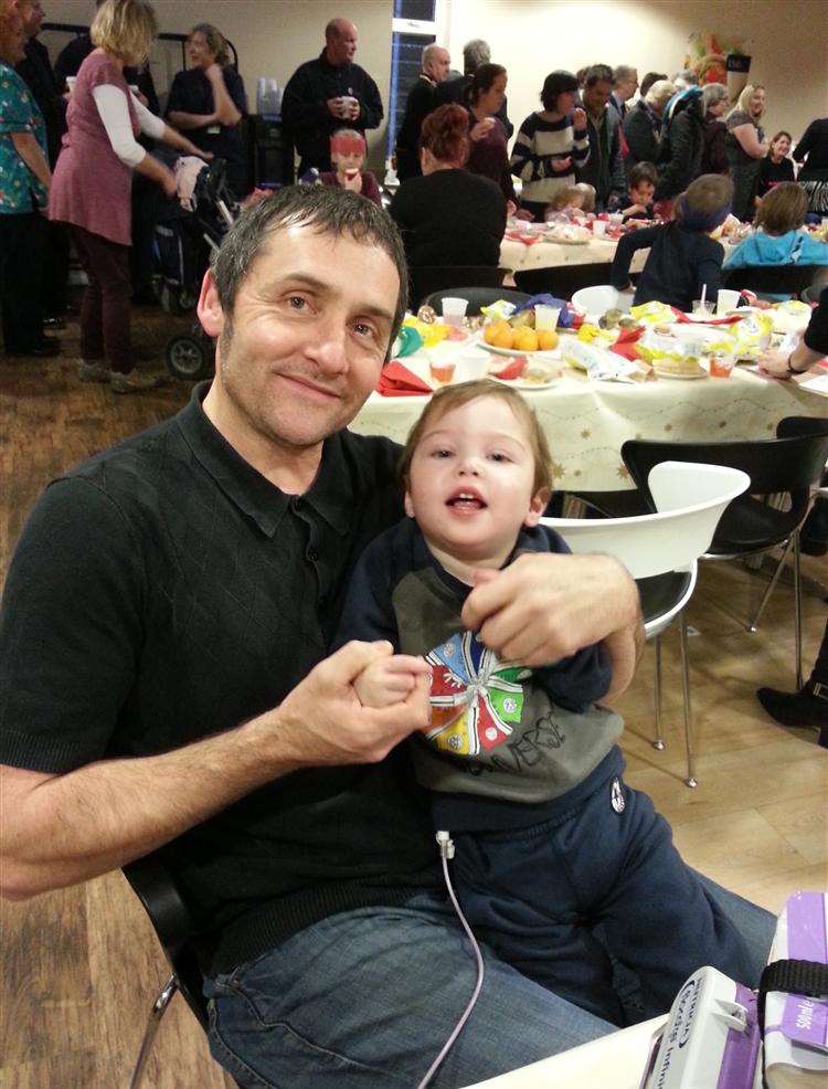 Archie Page, now two, and dad Dave, from Broadstairs, at the QEQM Hospital's Rainbow Ward Christmas party