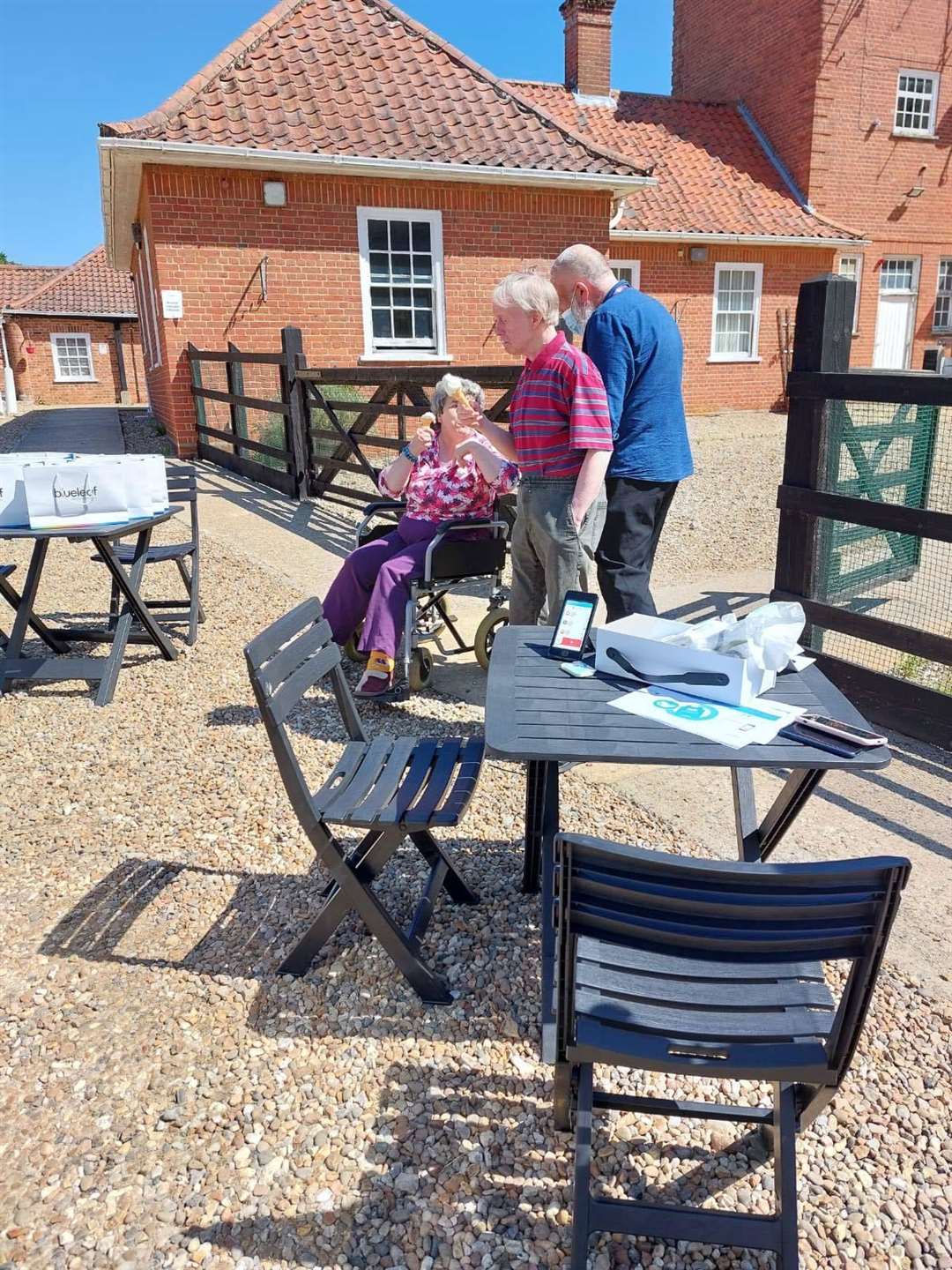 Residents enjoying ice cream in the sunshine (57497782)