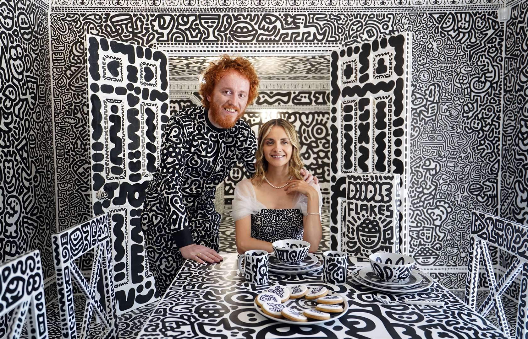 British artist Sam Cox, aka Mr Doodle, with his wife Alena (Gareth Fuller/PA)