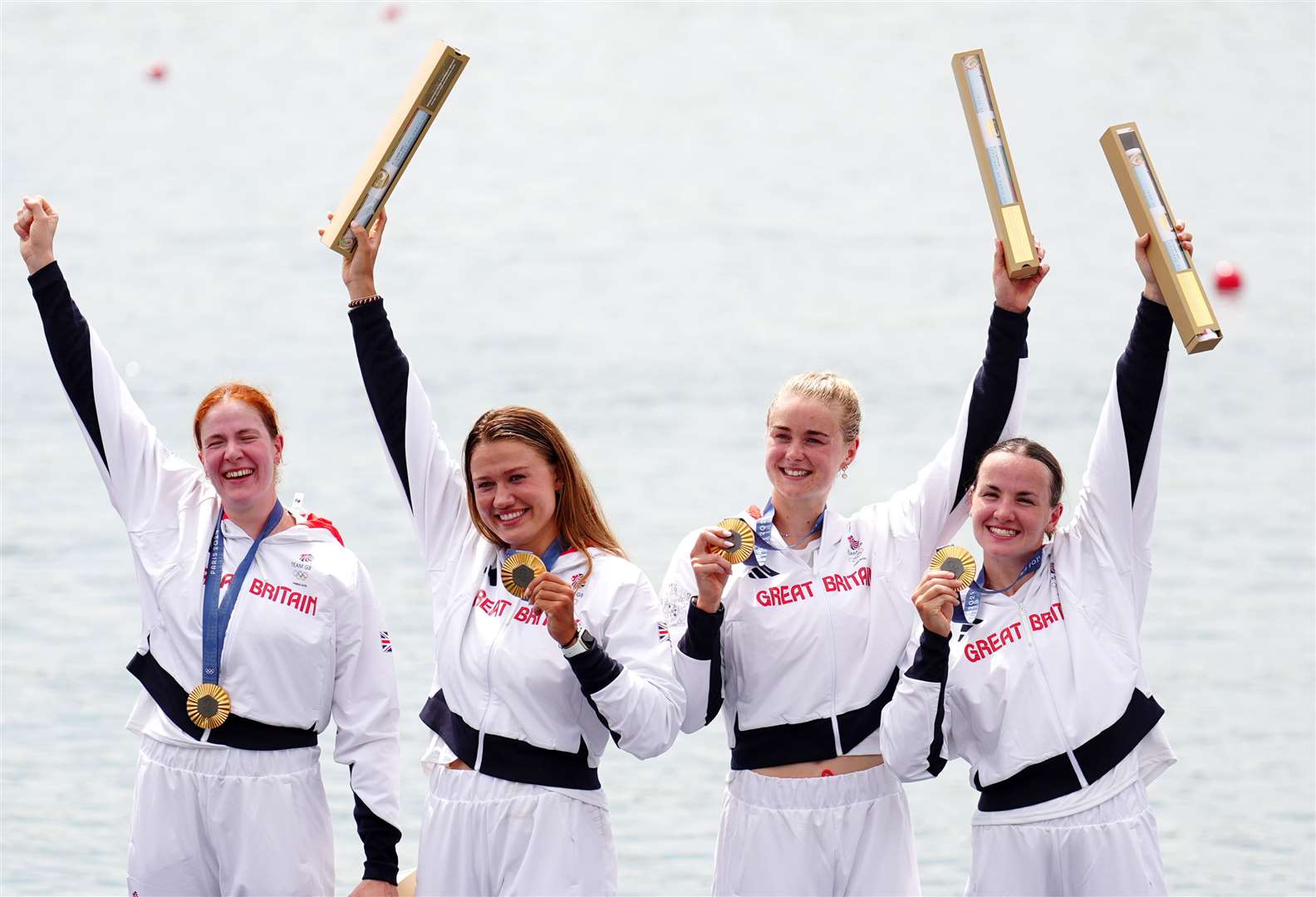 Great Britain’s Georgie Brayshaw, Lola Anderson, Hannah Scott and Lauren Henry are presented with their gold medals in Paris (Mike Egerton/PA)