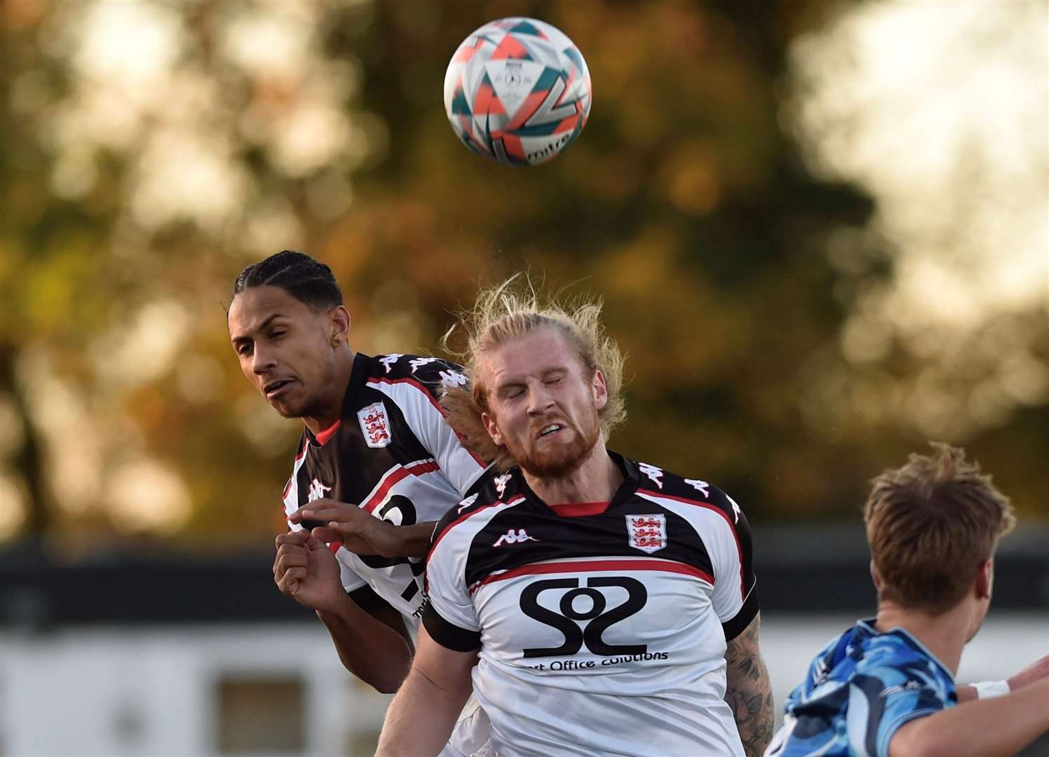 New Faversham addition Finn O'Mara, front, and Jordan Ababio compete in the air in their Kent Senior Trophy 2-0 defeat to Lordswood on Saturday. Picture: Ian Scammell