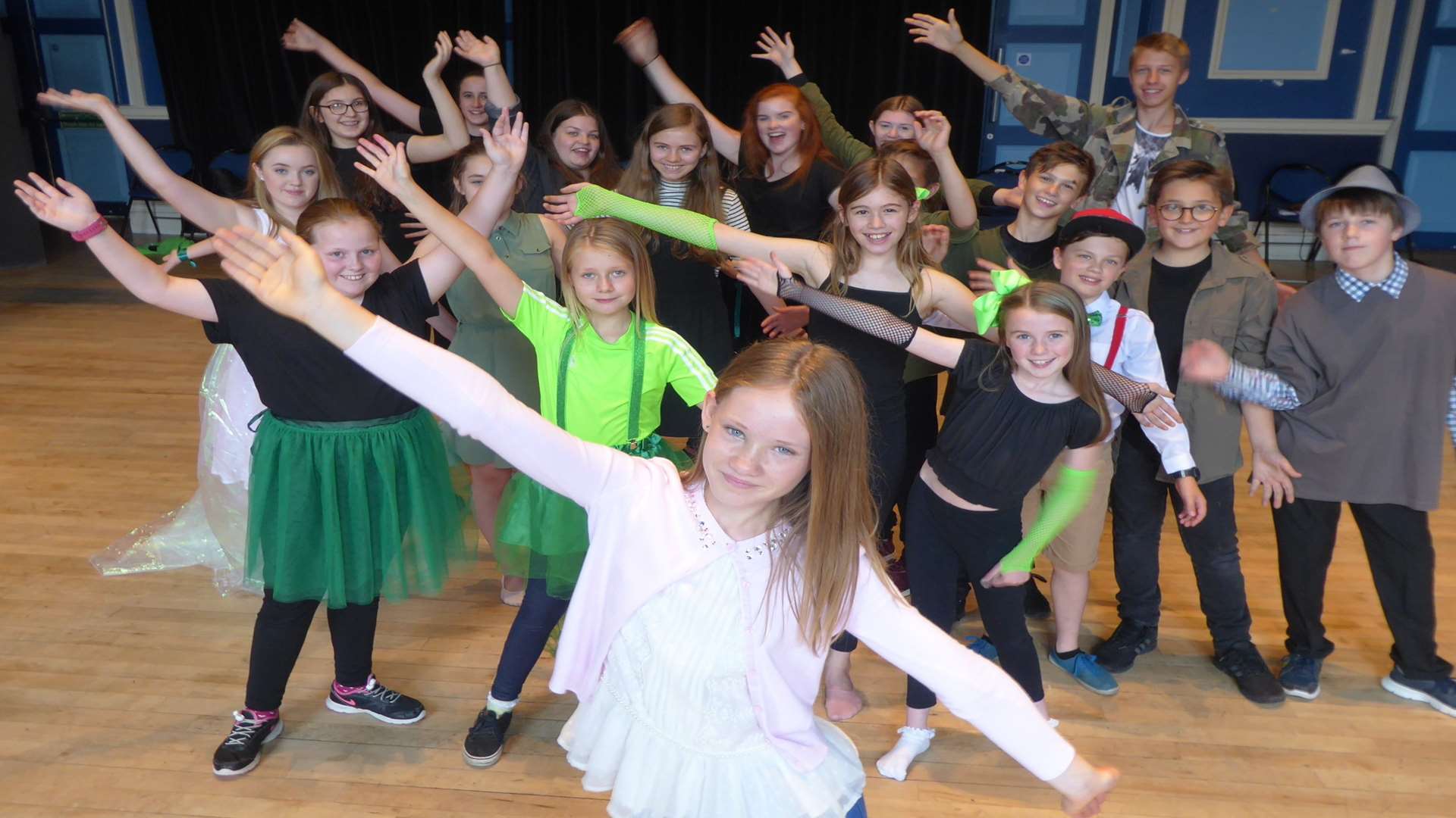 Contest winner Molly Simmonds leads the warm up for the Hazlitt Youth Theatre cast of Wicked.