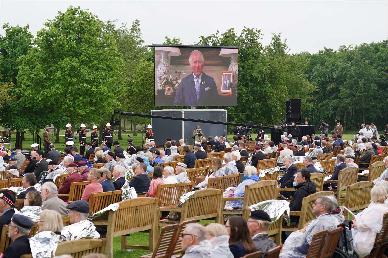 Veterans watch the official opening of the British Normandy Memorial in France (Jacob King/PA)