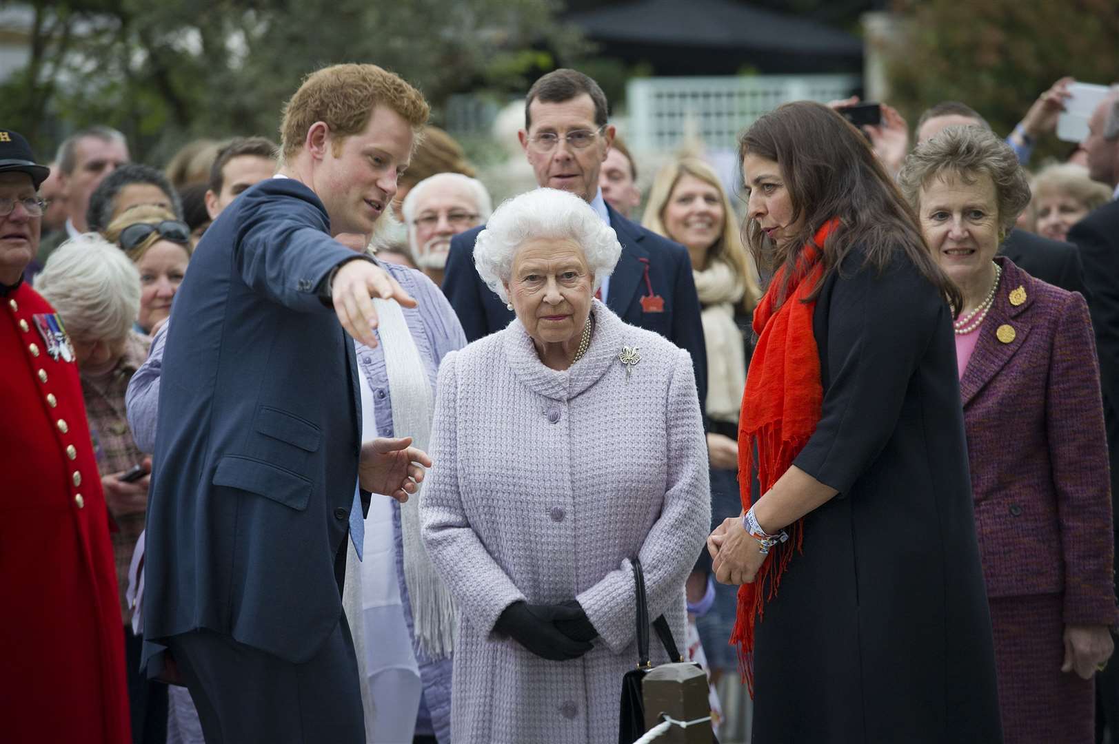 Harry gives his grandmother the Queen a tour of his Sentebale garden at the Chelsea Flower Show in 2013 (Geoff Pugh/PA)
