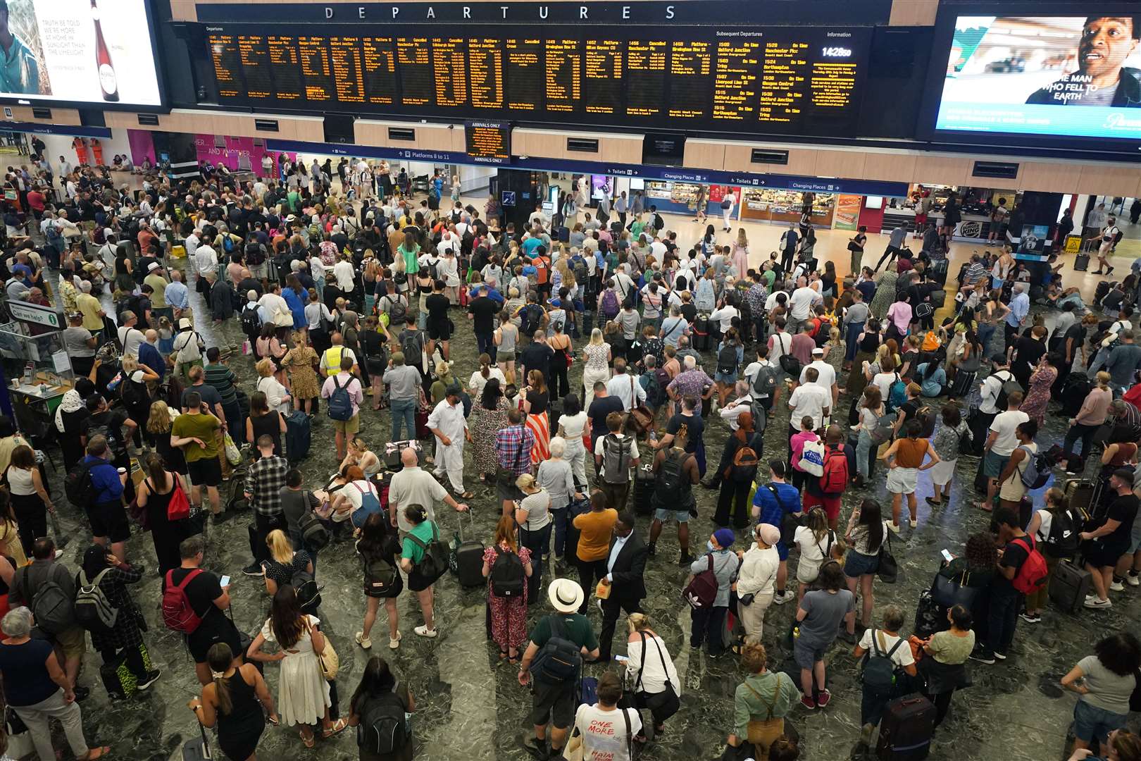 Passengers at Euston station in London following train cancellations in the summer (Yui Mok/PA)