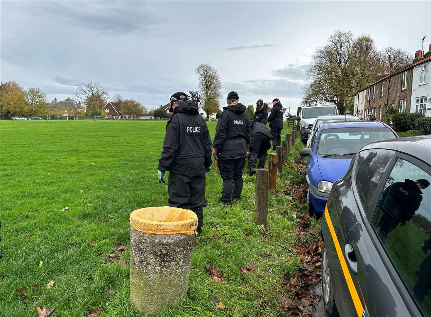 Police trawled through the green opposite the Cricketers Inn pub in Meopham. Picture: UKNIP