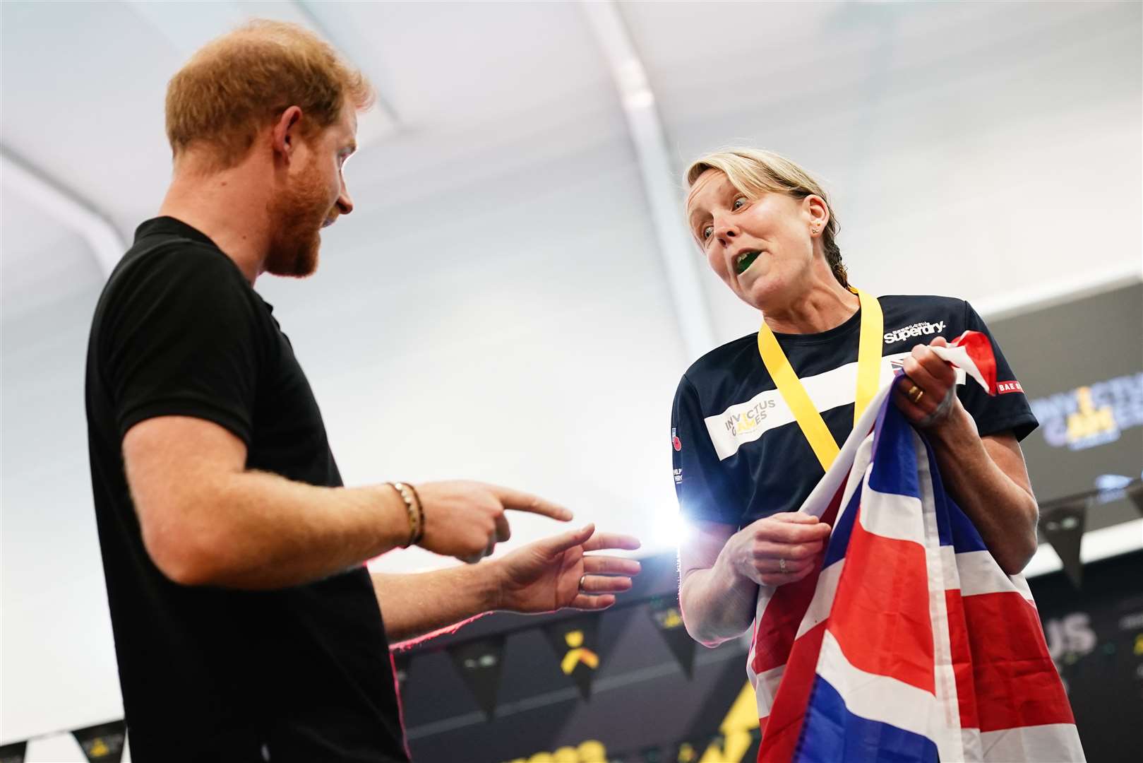 The Duke of Sussex speaks to a British competitor during the swimming at the Invictus Games (Aaron Chown/PA)