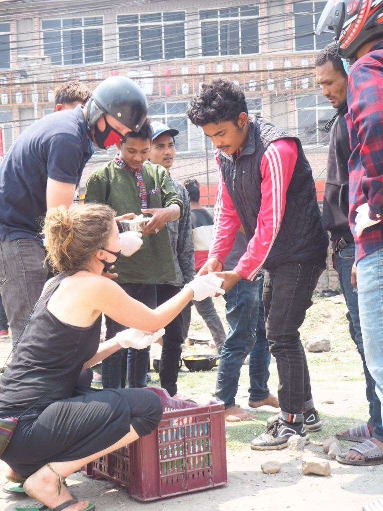 Volunteers give out food to people in Kathmandu. Picture: Richard Bayfield
