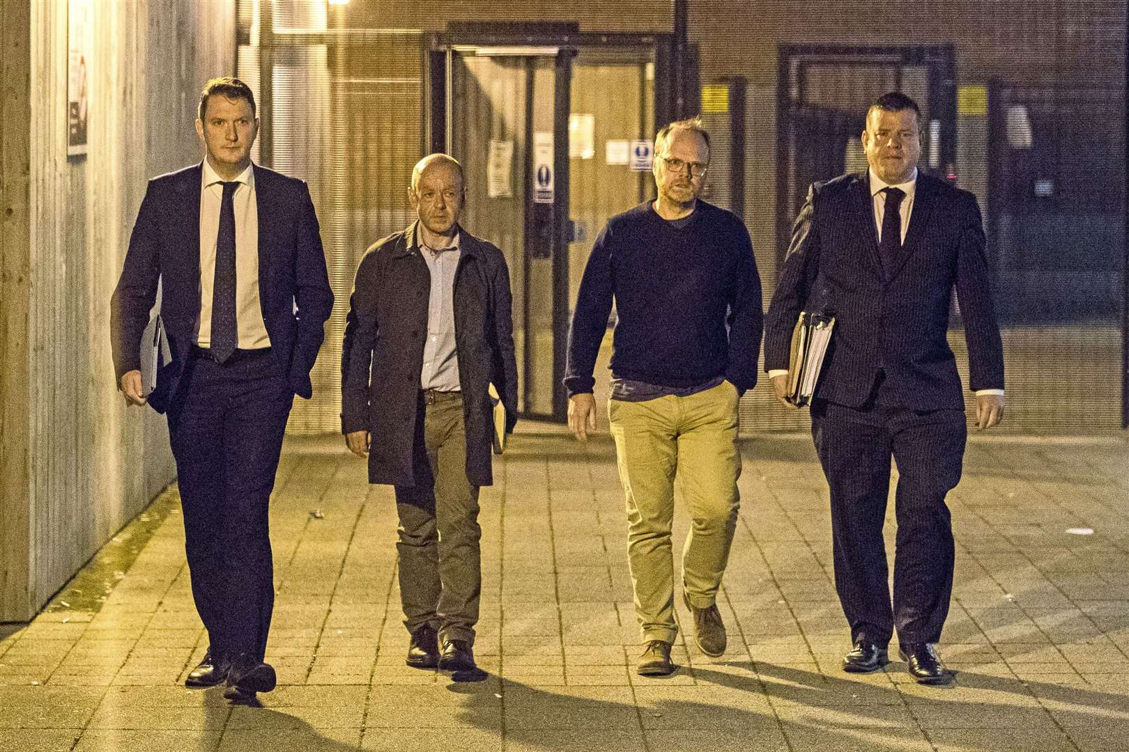 Barry McCaffrey (centre left) and Trevor Birney (centre right) with solicitors Niall Murphy (right) and John Finucane (left) leaving Musgrave Street police station in Belfast after their arrest in 2018 (Liam McBurney/PA)