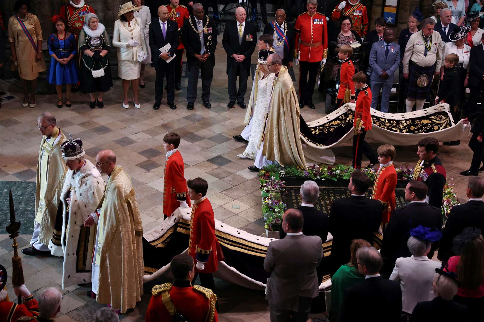 The King and Queen departing Westminster Abbey after their coronation in May (Phil Noble/PA)