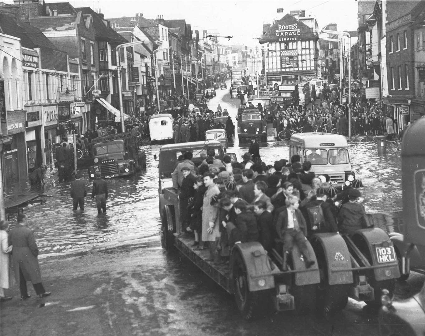 People waited for lorries to get them through the water at the bottom end of Maidstone High Street in 1953