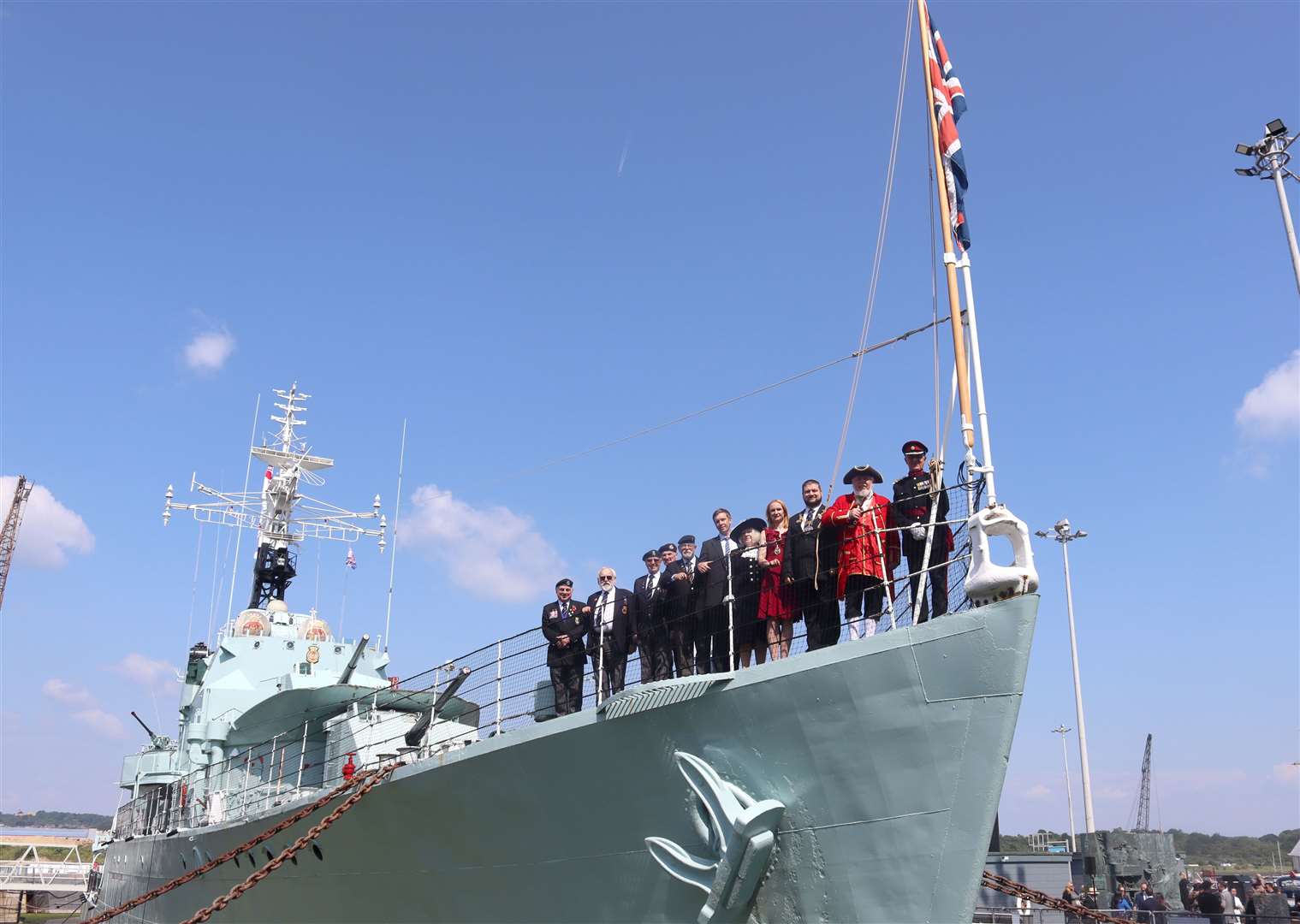 Guests, who included Brigadier Peter Gilbert, Mike Billingham, Medway’s Town Crier; Marian Nestorov, The Mayor of Medway, and his wife, Liubov Nestorov; Dr Gillian Fargher, High Sheriff of Kent; Richard Morsley, Chief Executive of Chatham Historic Dockyard Trust; and Medway veterans from the Royal Naval Association and Medway and West Kent Armed Forces Veterans Breakfast Club stand at the bow of HMS Cavalier