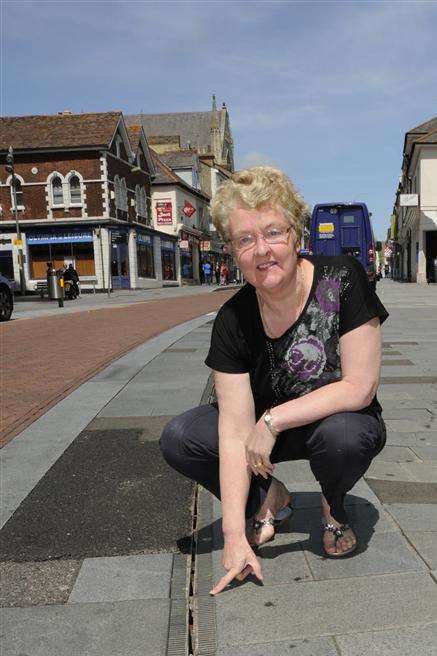 Tiny Tots shop owner Sally Starley points out the damage