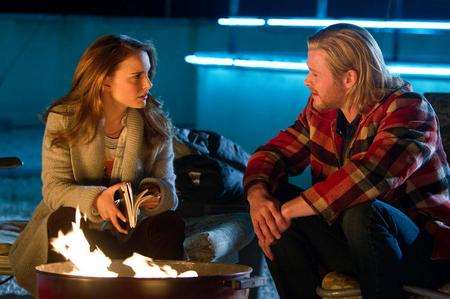 Natalie Portman as Jane Foster and Chris Hemsworth as Thor.