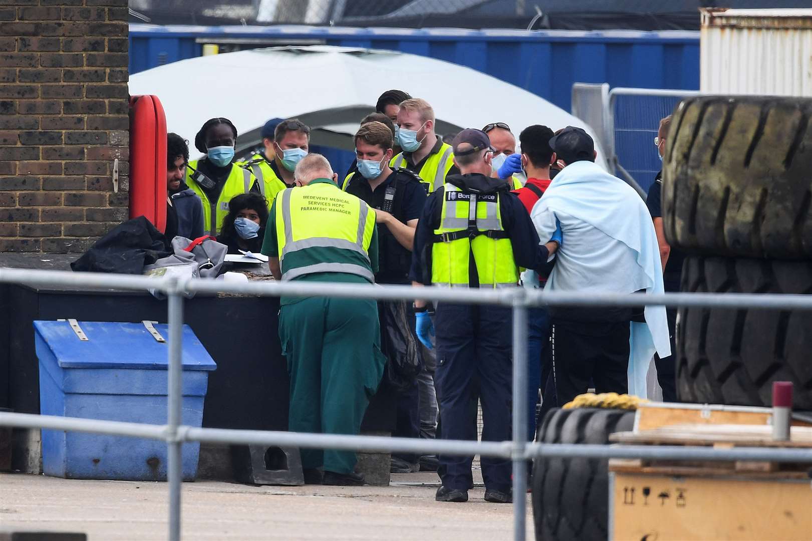 A group of people thought to be migrants have their temperatures checked as they are brought into Dover by Border Force officers (Kirsty O’Connor/PA)