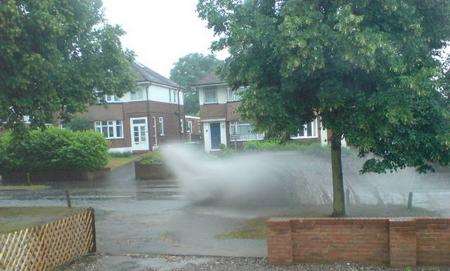 A motorist ignores the floods in Sandling Lane, Maidstone