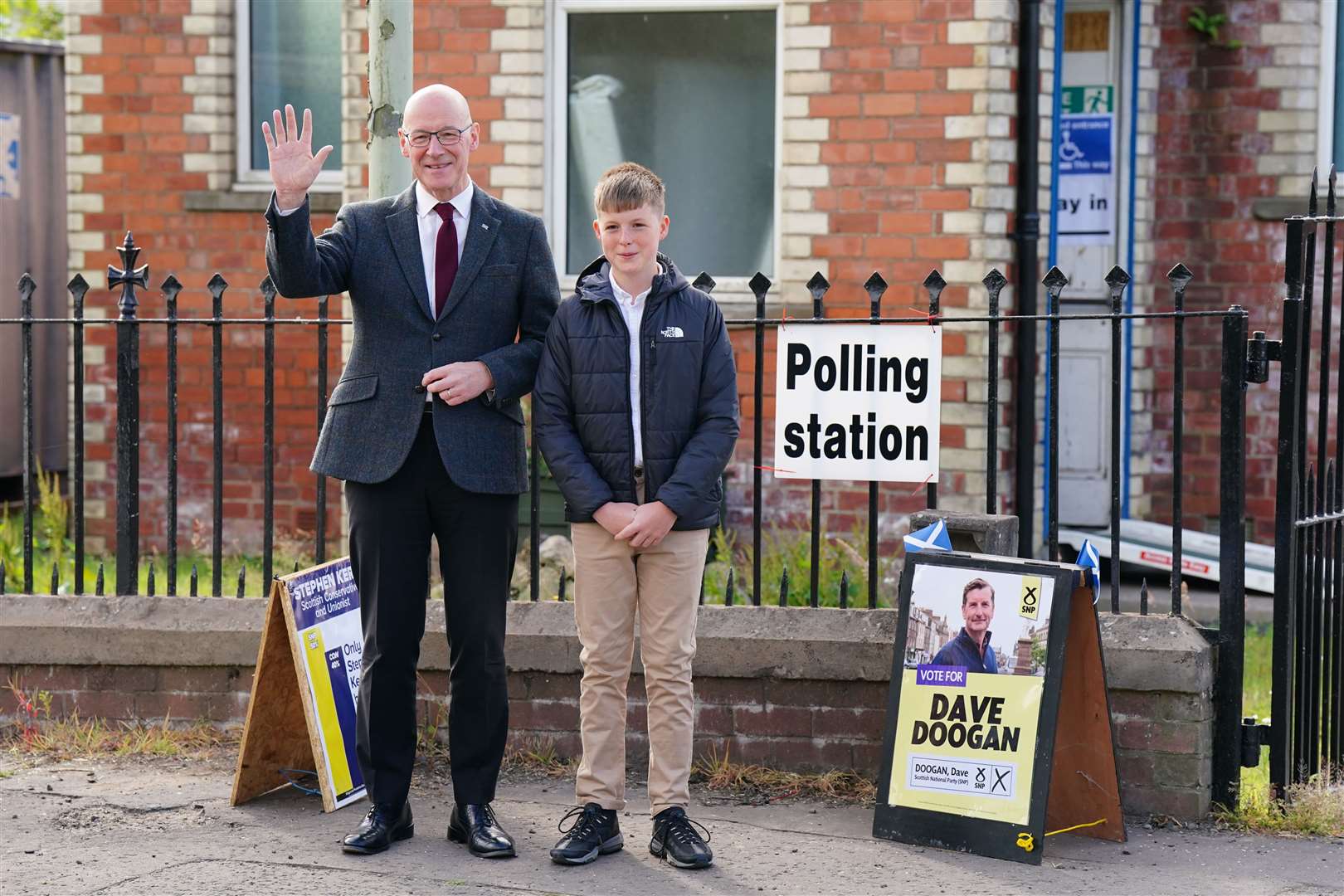 John Swinney and his son Matthew arrive at Burreltown Village Hall as the First Minister cast his ballot (Jane Barlow/PA)