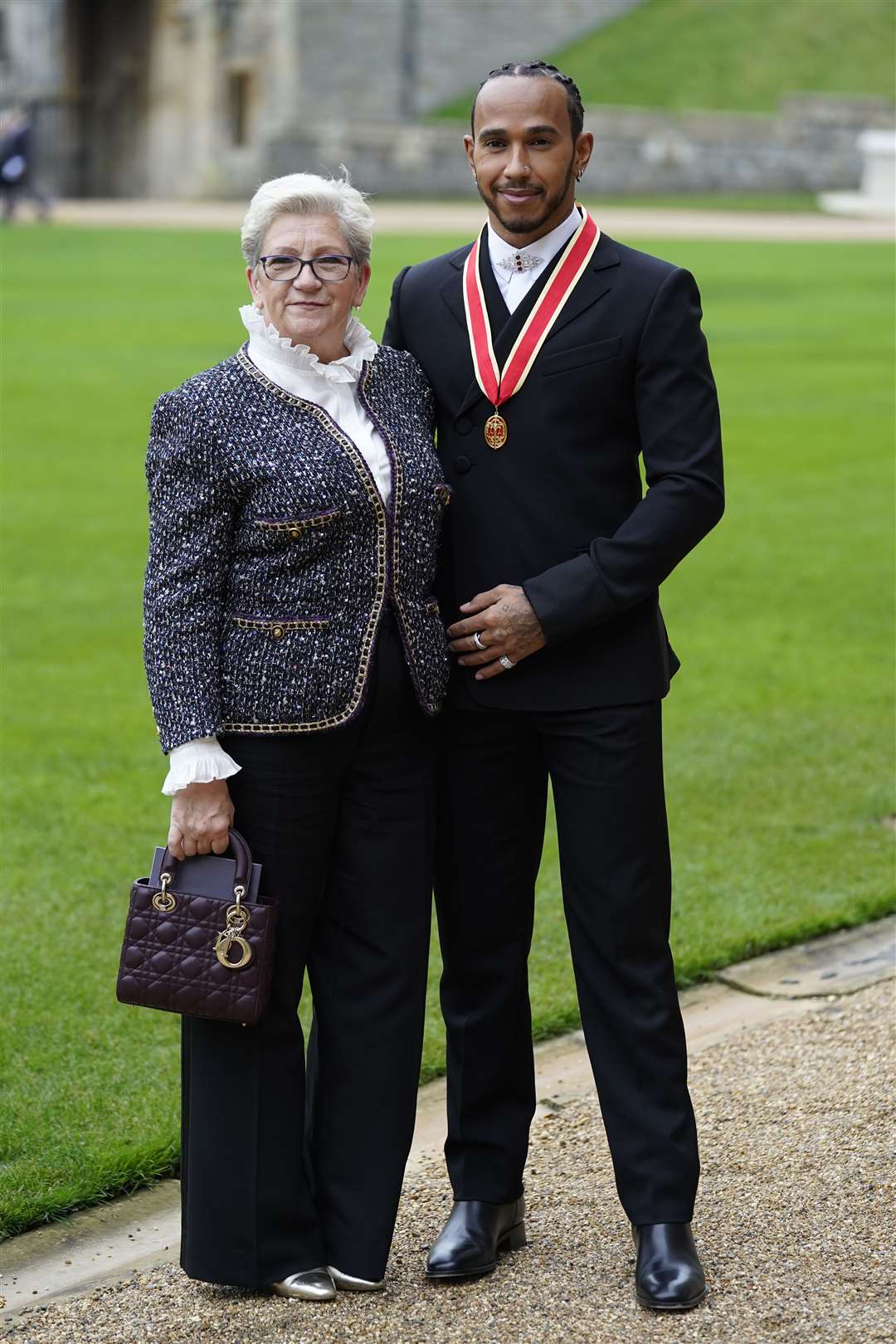 Sir Lewis took his mother Carmen Lockhart with him to the ceremony (Andrew Matthews/PA)