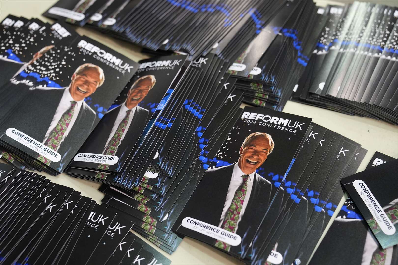 Conference guides with Nigel Farage picture on them at the National Exhibition Centre in Birmingham (Joe Giddens/PA)