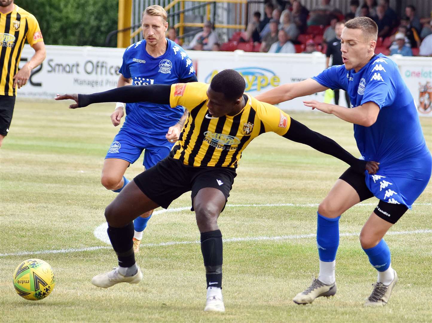 Dover's Arjanit Krasniqi closes down Folkestone frontman Ade Yusuff during the weekend's friendly which finished 1-0 to Invicta. Picture: Randolph File