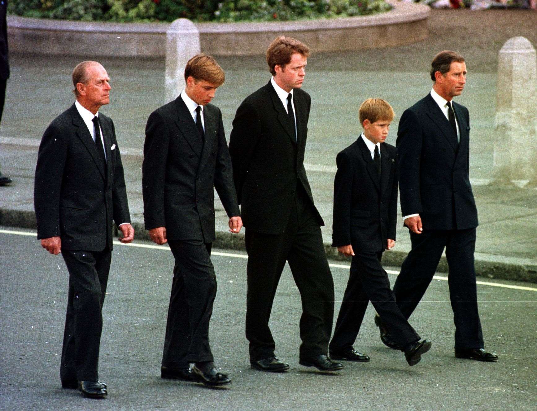 The Duke of Edinburgh, Prince William, Earl Spencer, 12-year-old Prince Harry and the Prince of Wales walking behind the coffin of Diana, Princess of Wales (Adam Butler/PA)