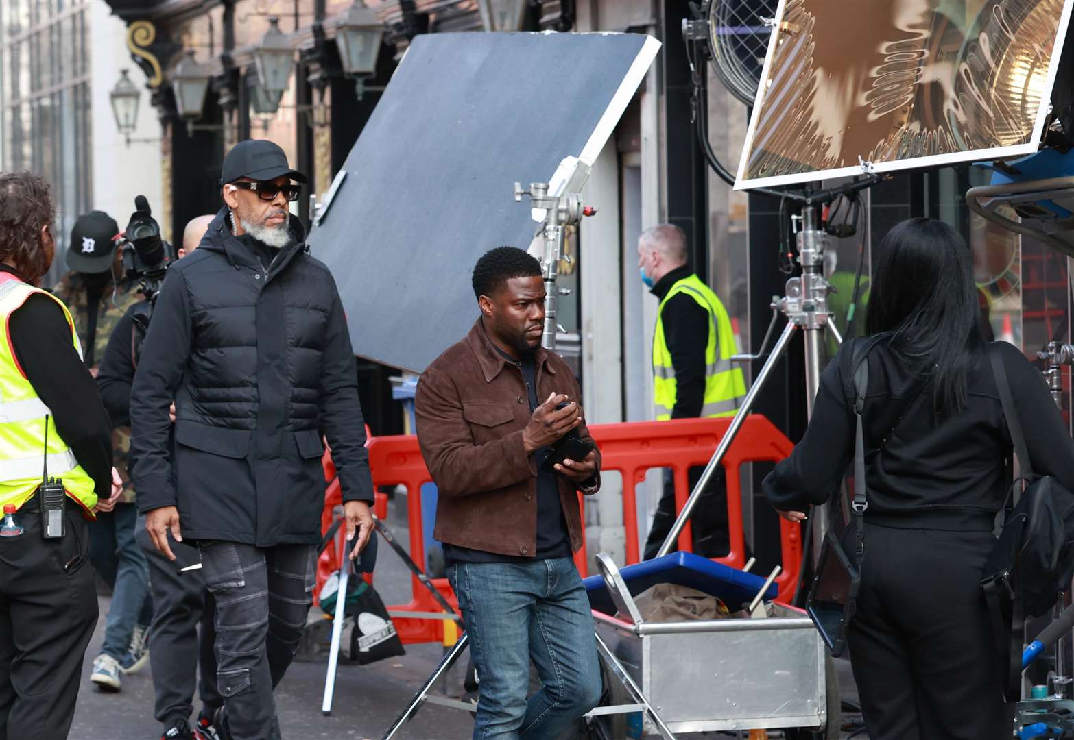 American comedian Kevin Hart (centre) on set during the filming of heist comedy Lift at the Crown Bar in Belfast in 2022 (PA)