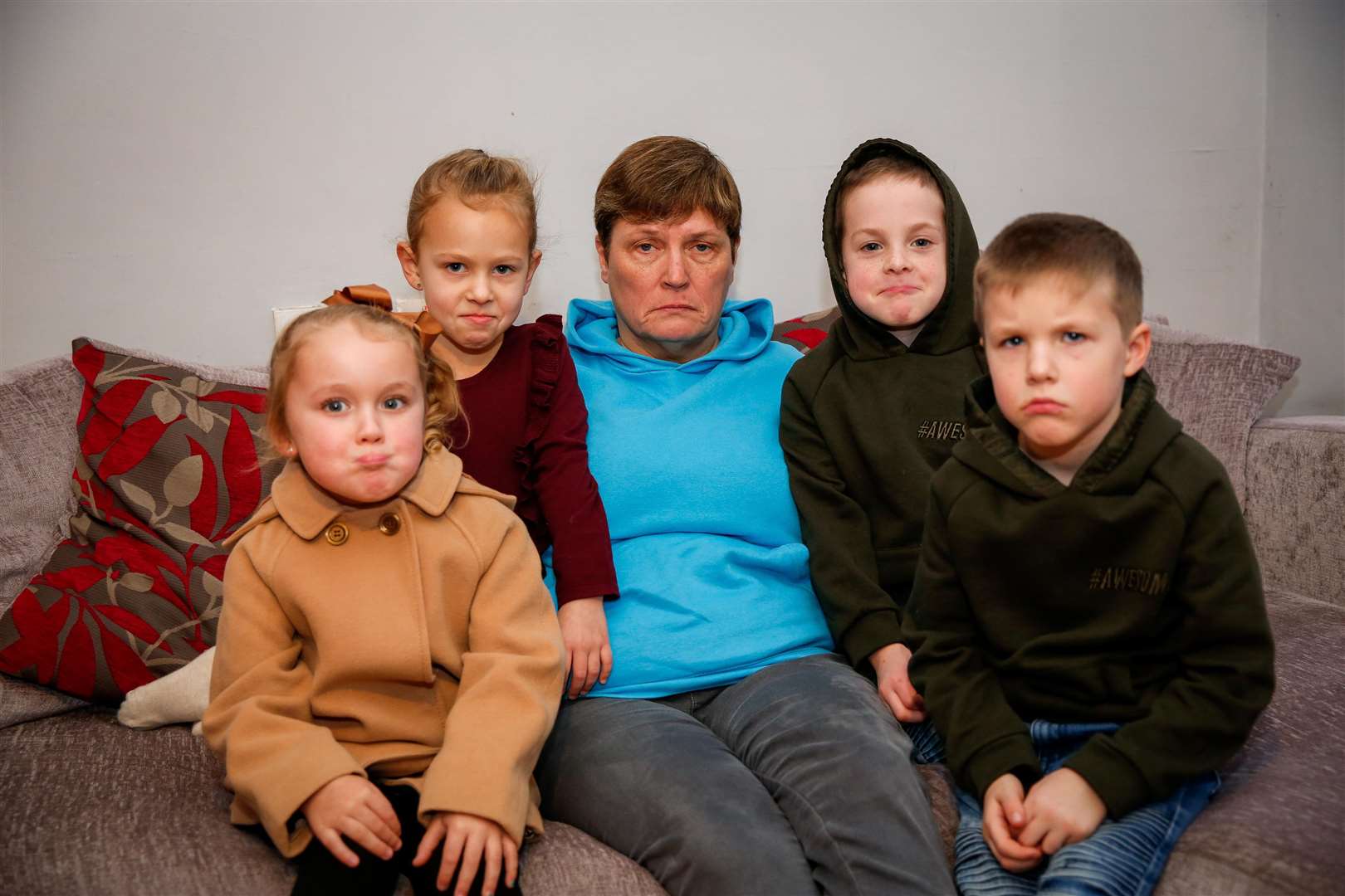 Sue More pictured with youngsters Scarlet Sammells, five, Cara Seager, five, and twins Liam and Jake Mann, seven, who have still not received a refund from the Maidstone Panto. Picture: Matthew Walker. (6333061)