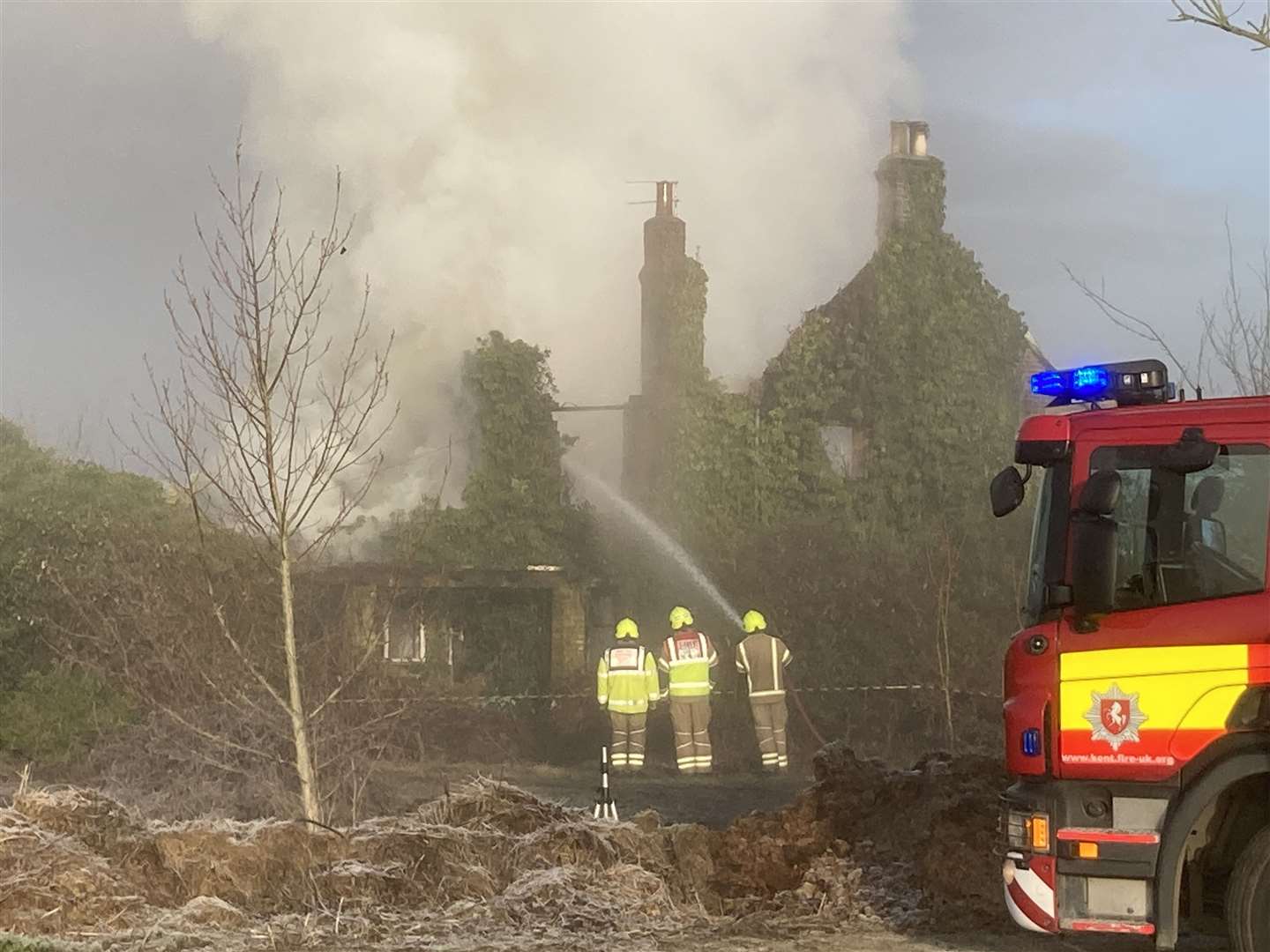 Fire crews putting out the derelict building blaze in Elm Lane, Minster. Picture: John Nurden