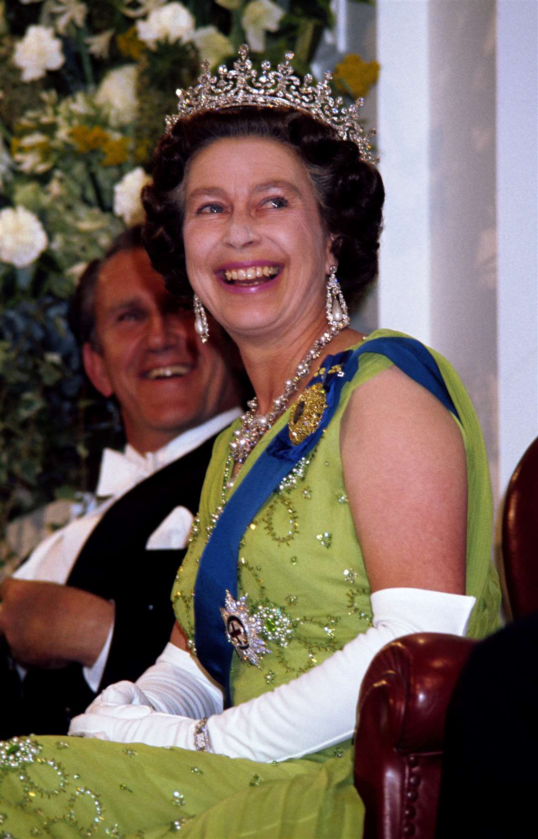 The Queen laughs while attending a Government reception at Parliament House, Canberra (Ben Roll/PA)