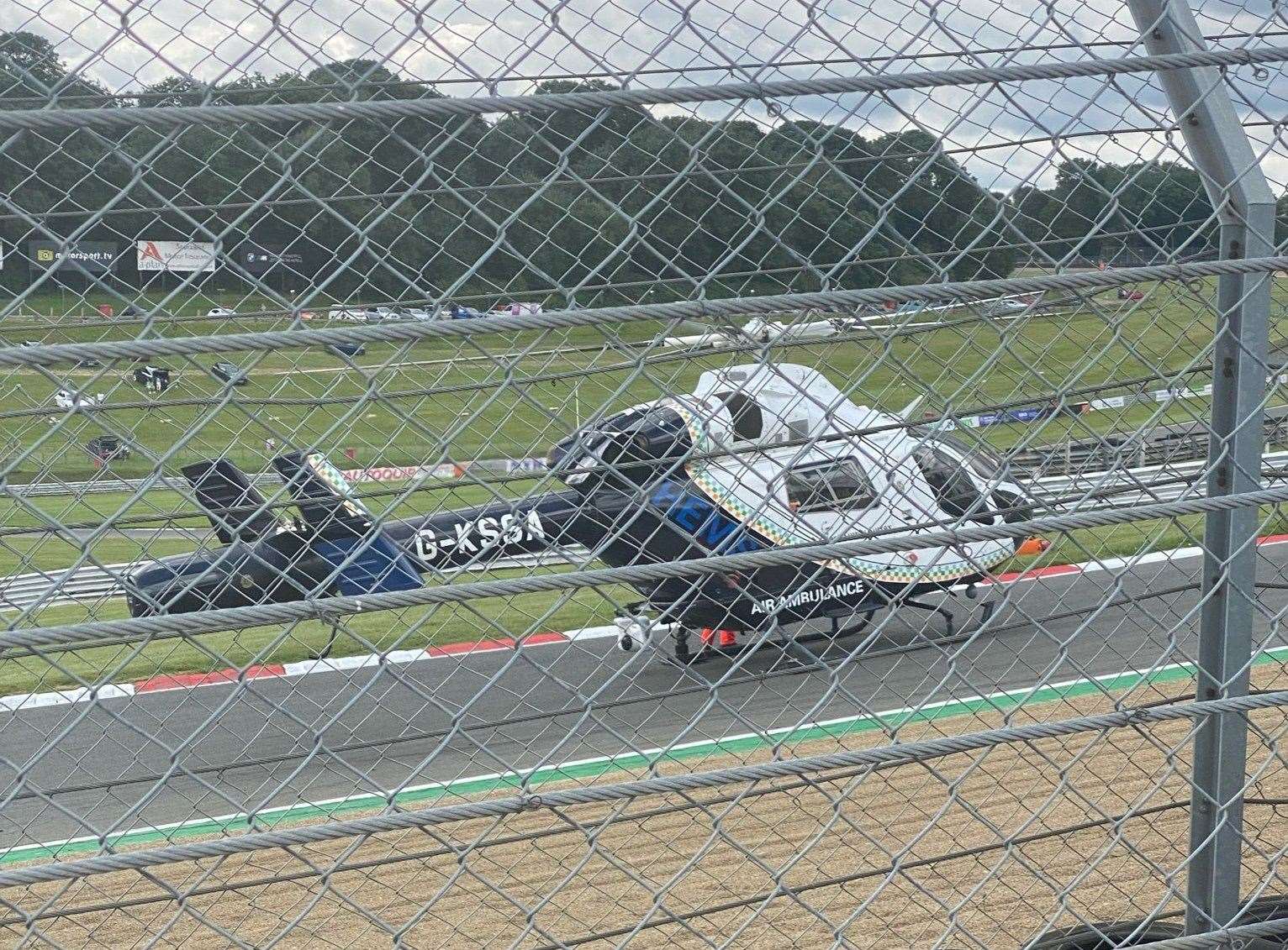The air ambulance at the scene of the crash at Brands Hatch. Picture: @FlooringKimpton/Twitter