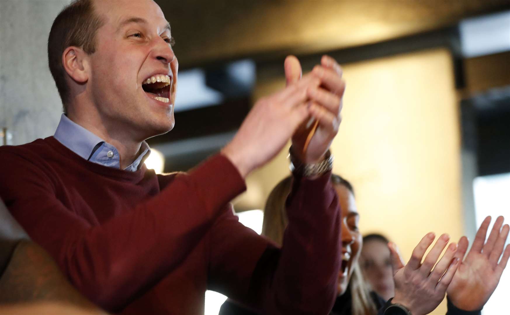 The Duke of Cambridge reacts as his team wins a table football match at the launch of The Heads Up Weekends in London (Frank Augstein/PA)