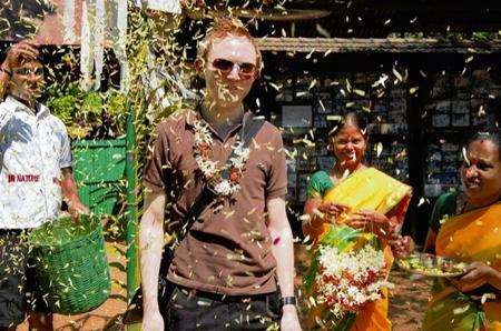 Danny Boyle is given a traditional welcome at the Sahakari spice farm, Goa