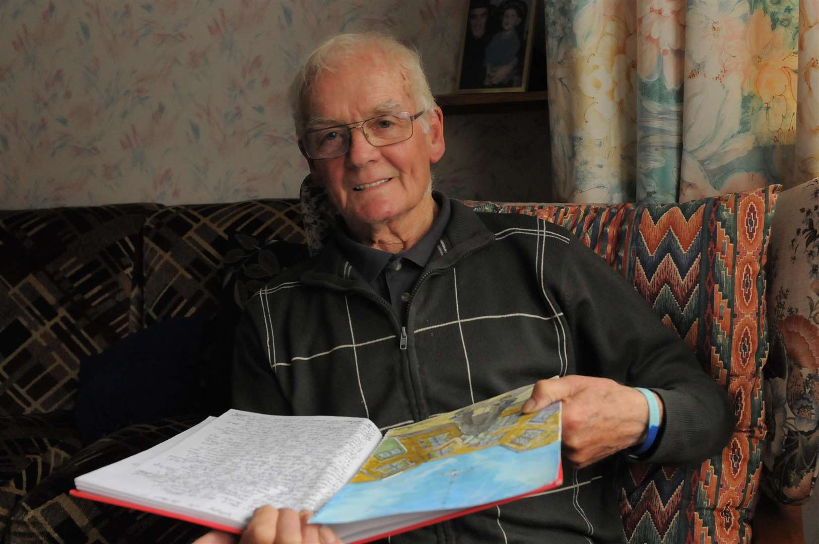 Denis Llewellyn with his book