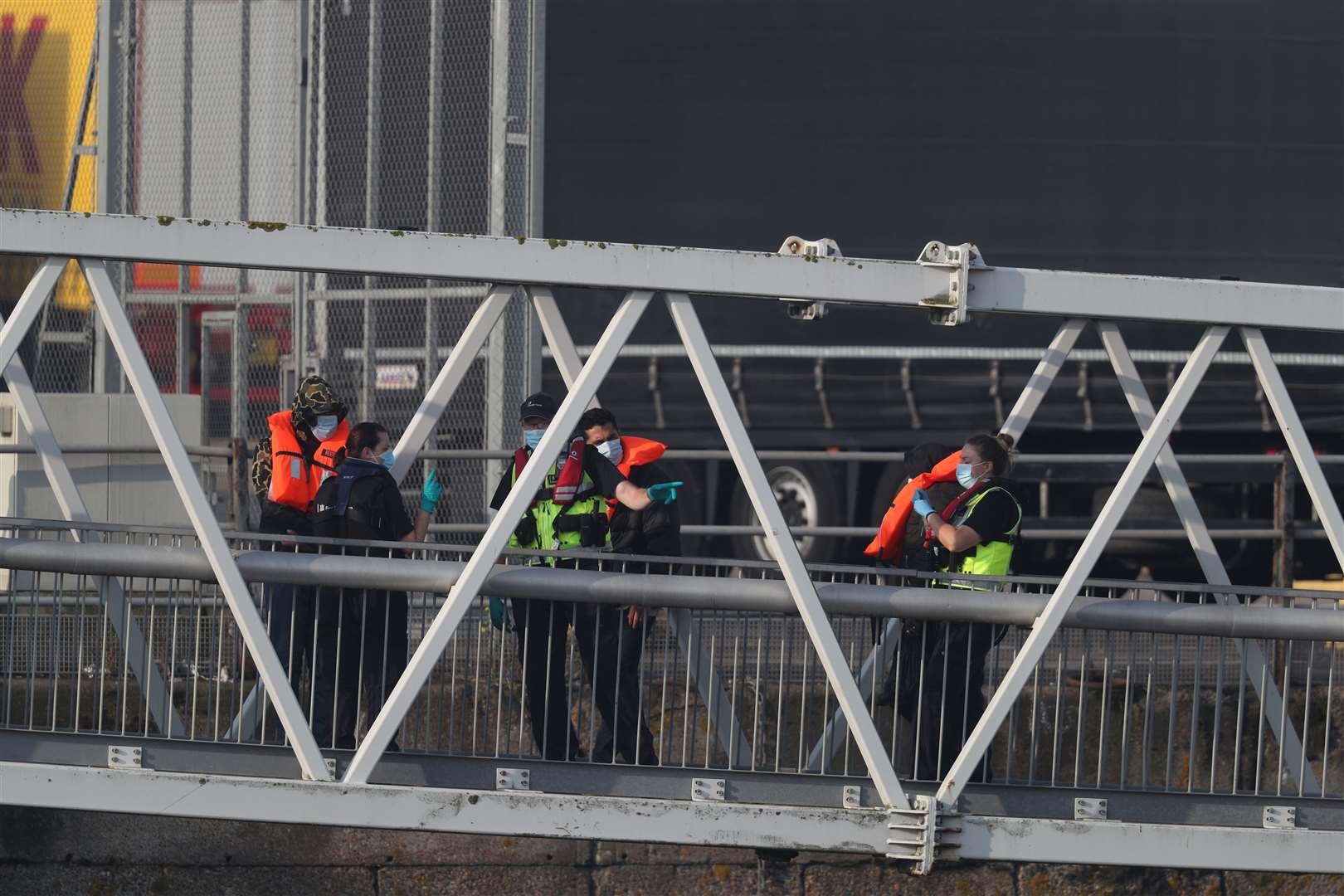 A group of people thought to be migrants are brought into Dover (Steve Parsons/PA)