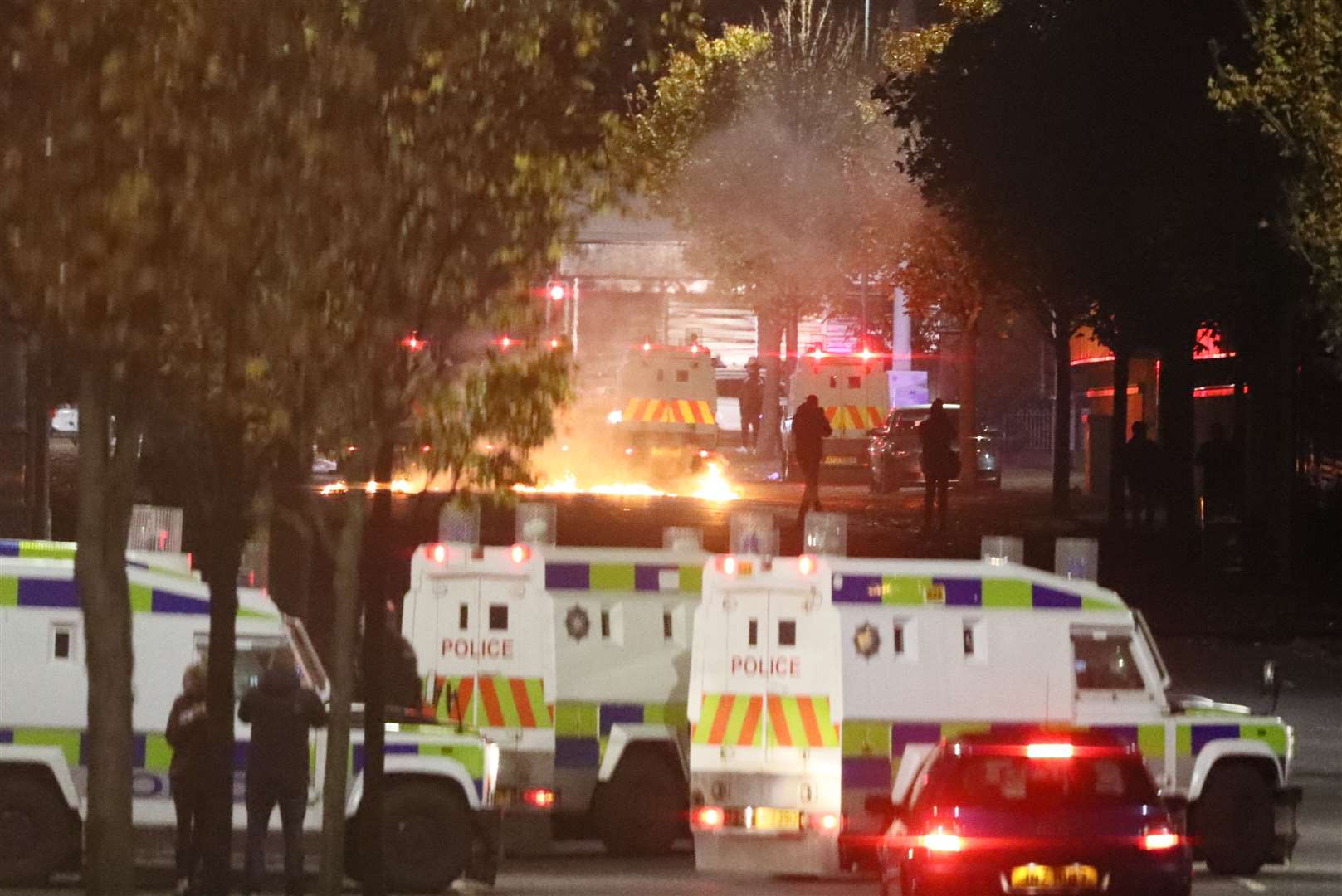 Missiles and fireworks being thrown at police on Lanark Way in the Loyalist Shankill Road area close to the peace wall in April. (PA)