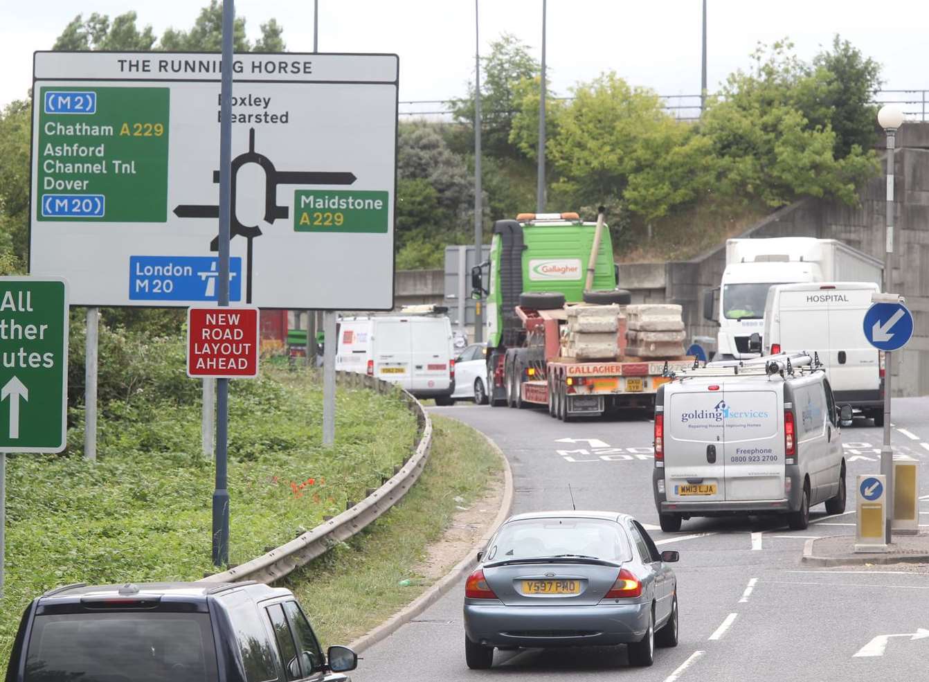 Queuing vehicles heading onto The Running Horse roundabout. Stock Picture