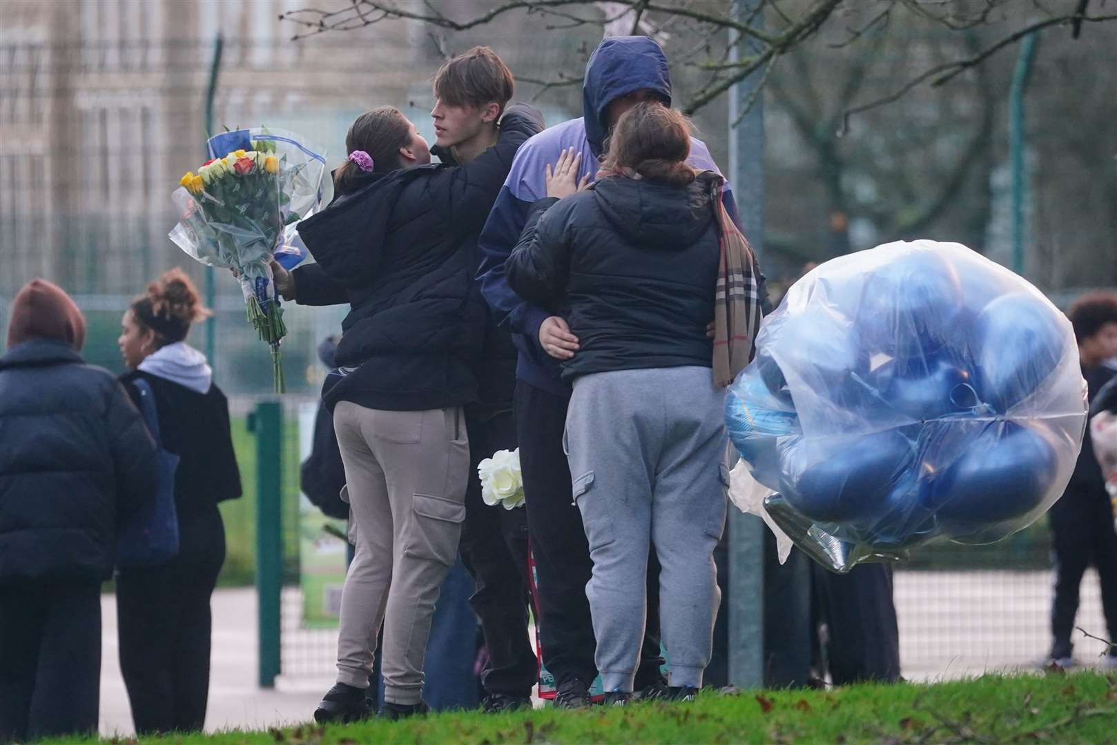 People arrive to take part in the vigil (PA)