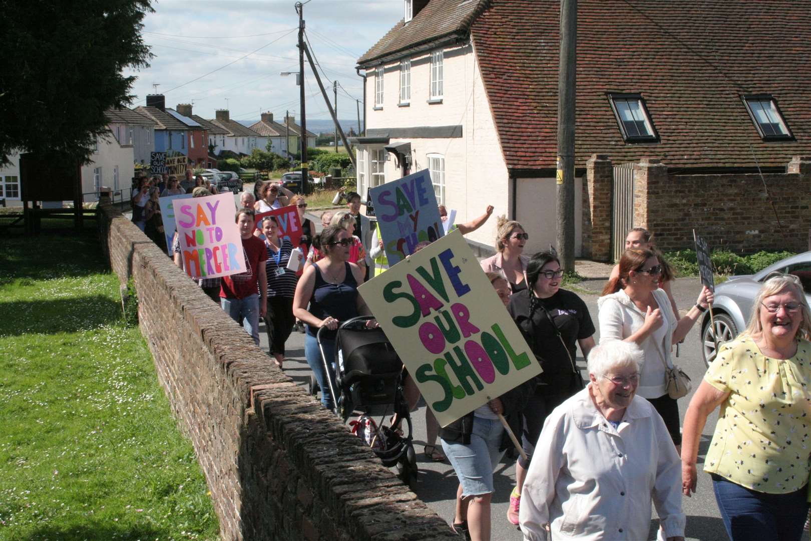 Protestors march from Stoke Primary Academy to Allhallows Primary Academy to rally against merger plans (13238487)