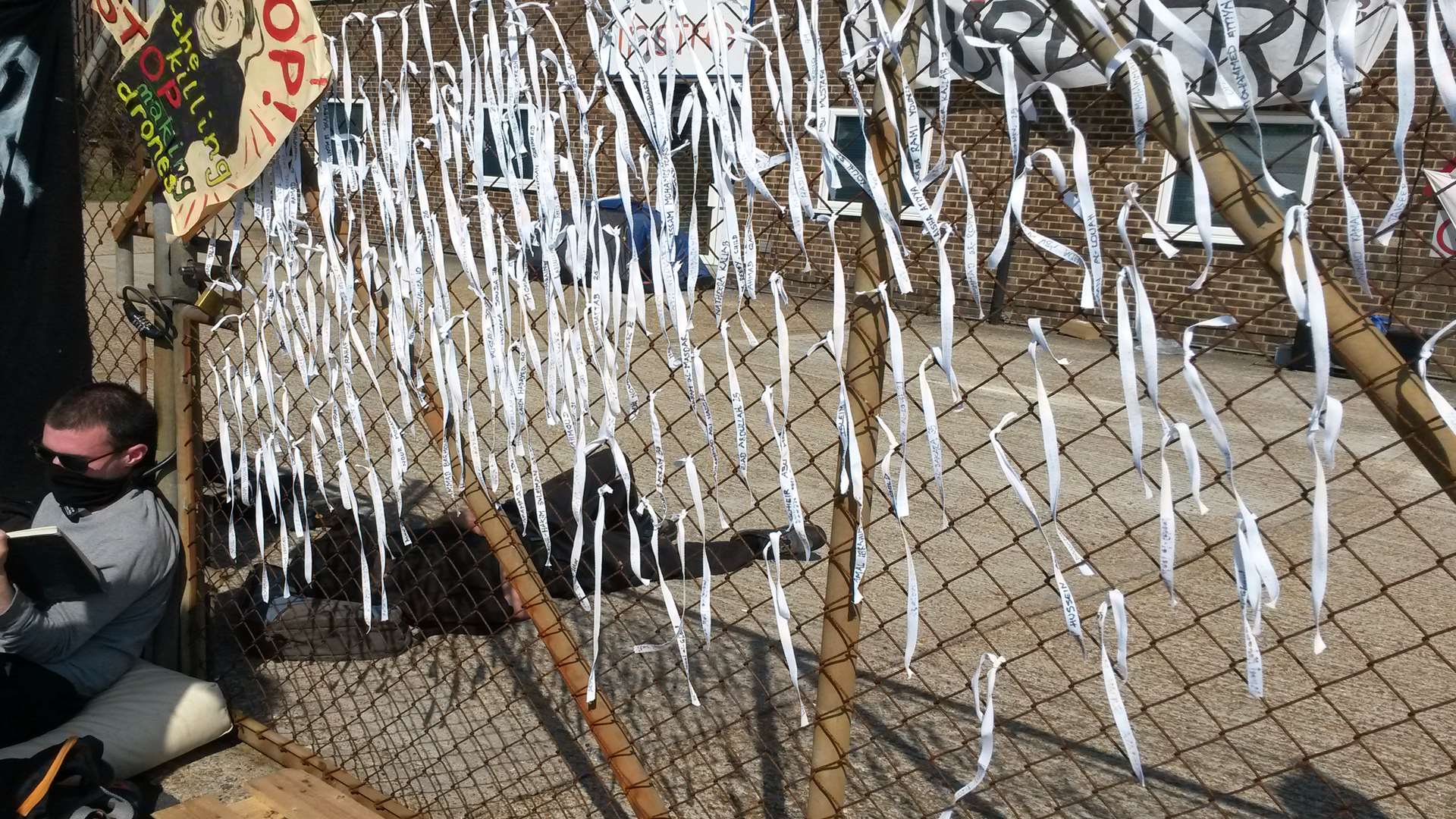 Ribbons with names of civilians killed in Gaza last summer