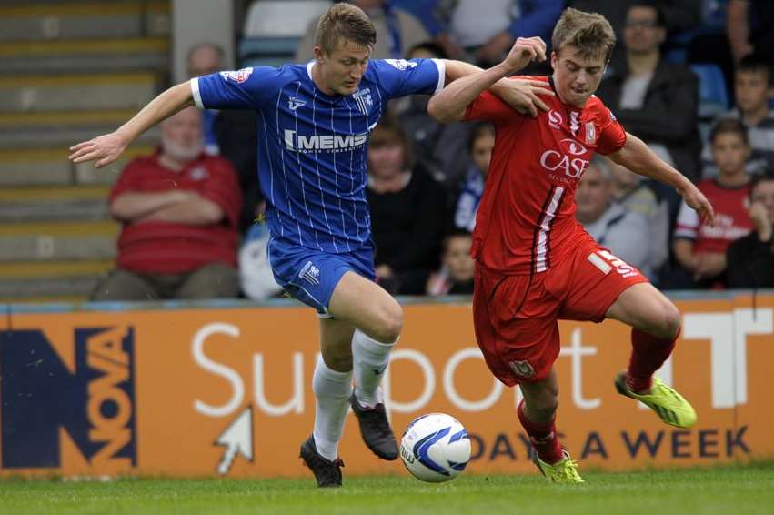 Callum Davies shows composure as he looks to bring the ball out of defence against MK Dons. Picture: Barry Goodwin