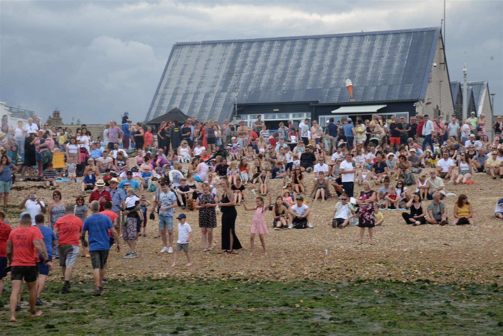 Spectators at Long Beach watch the 'Mud Tug' at the Oyster Festival last year