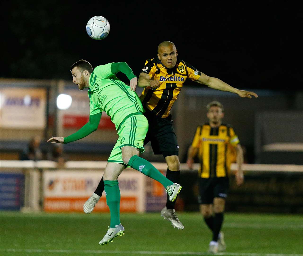 Maidstone forward Elliott Romain challenges in the air Picture: Andy Jones