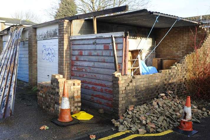 The storm-damaged garages