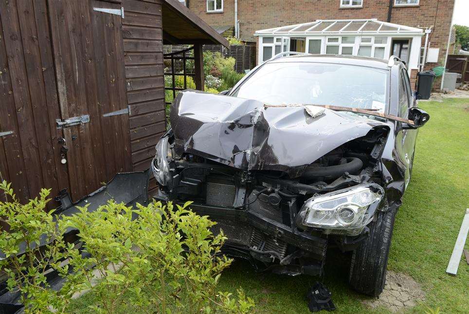 The black Nissan Qashqai which crashed into Richard and Joyce Farthing's garden at Wittersham
