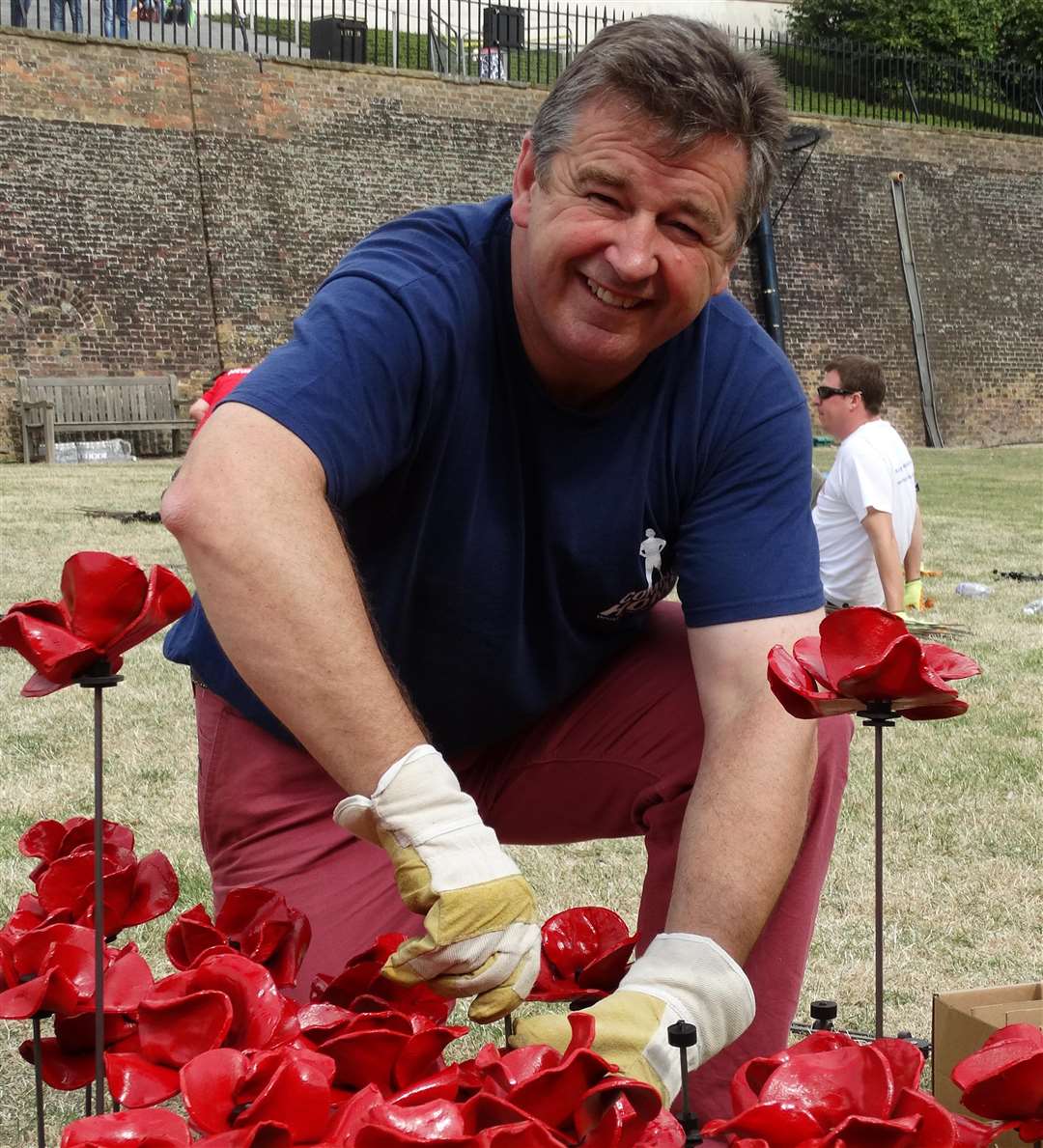 Brigadier James Richardson, CEO of Haig Housing planting poppies at the Tower of London