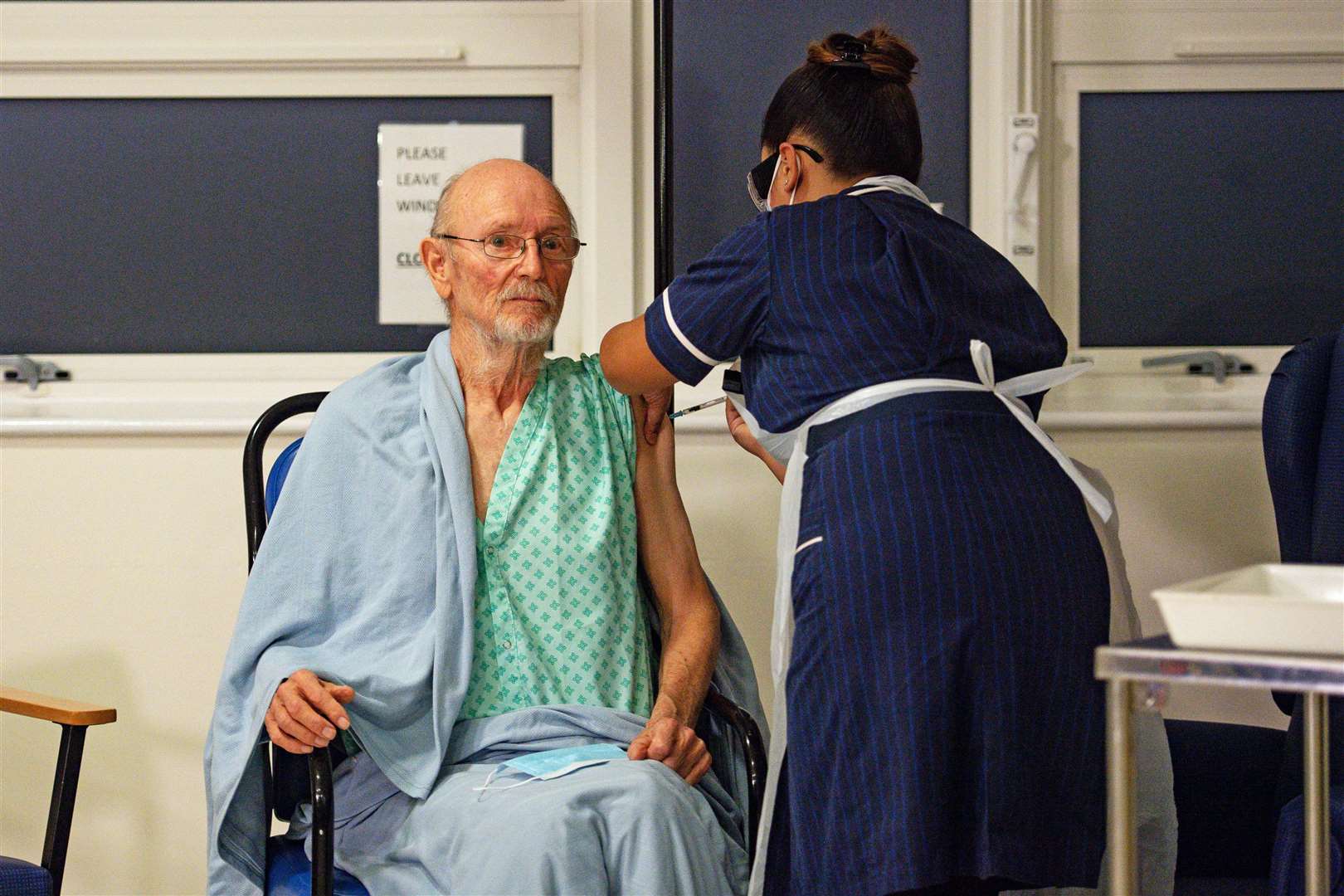 ‘Bill’ William Shakespeare, 81, receives the Pfizer/BioNTech covid-19 vaccine at University Hospital, Coventry (Jacob King/PA)